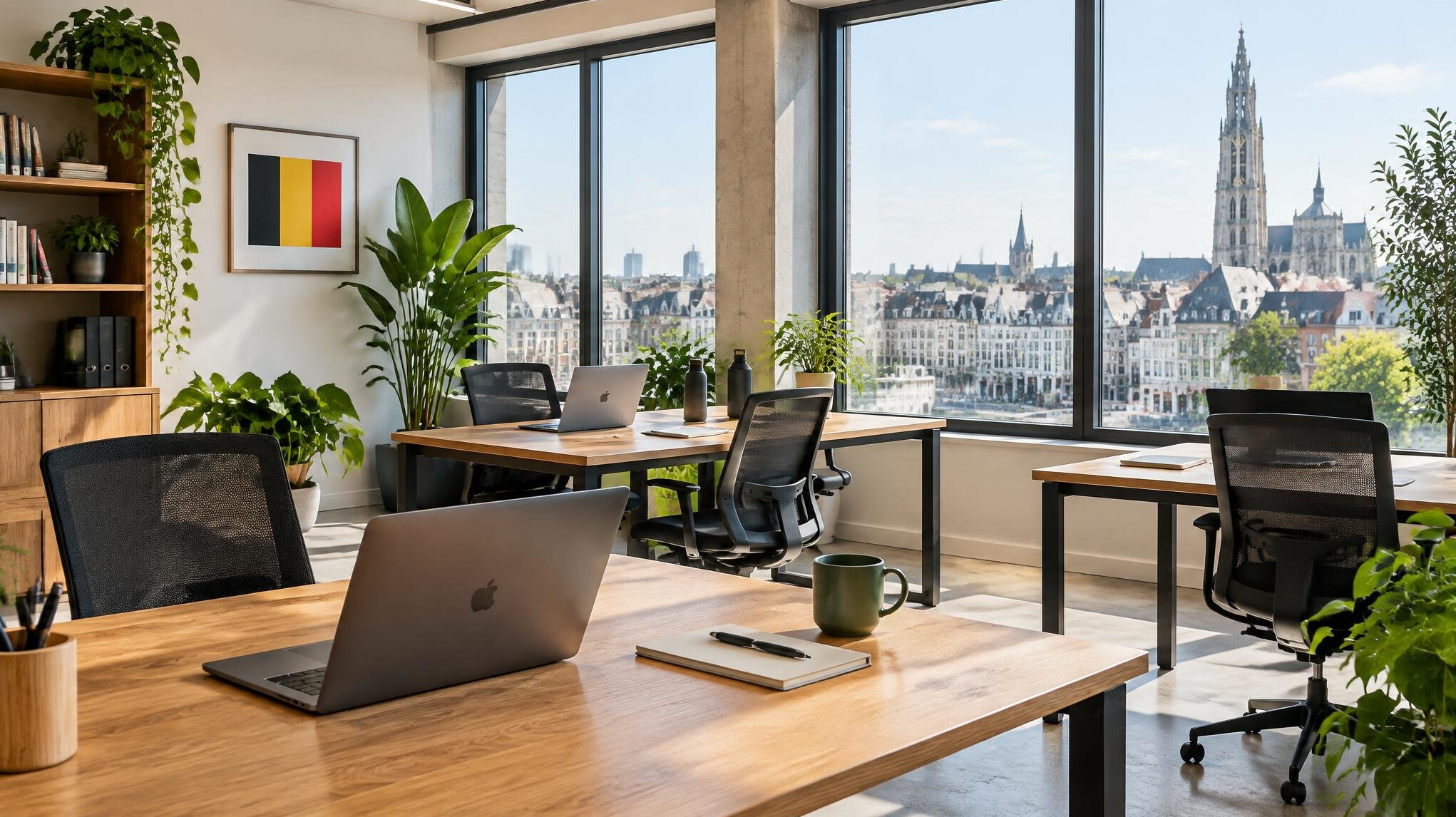 Modern office workspace with desks and plants